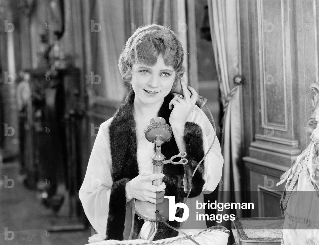 Portrait of Woman Using Telephone