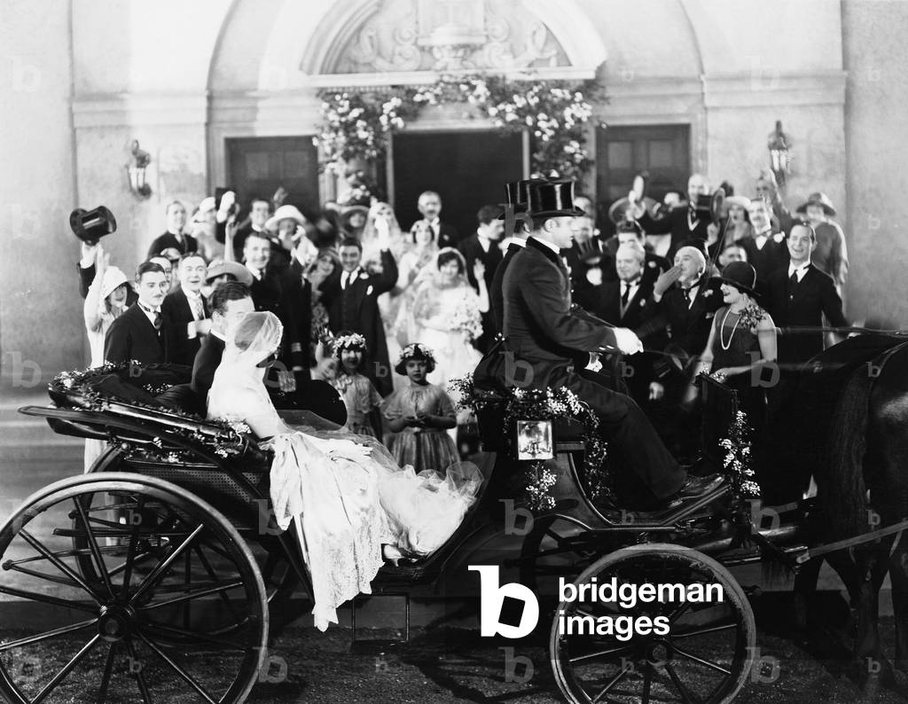 Newlyweds Leaving Wedding in Carriage