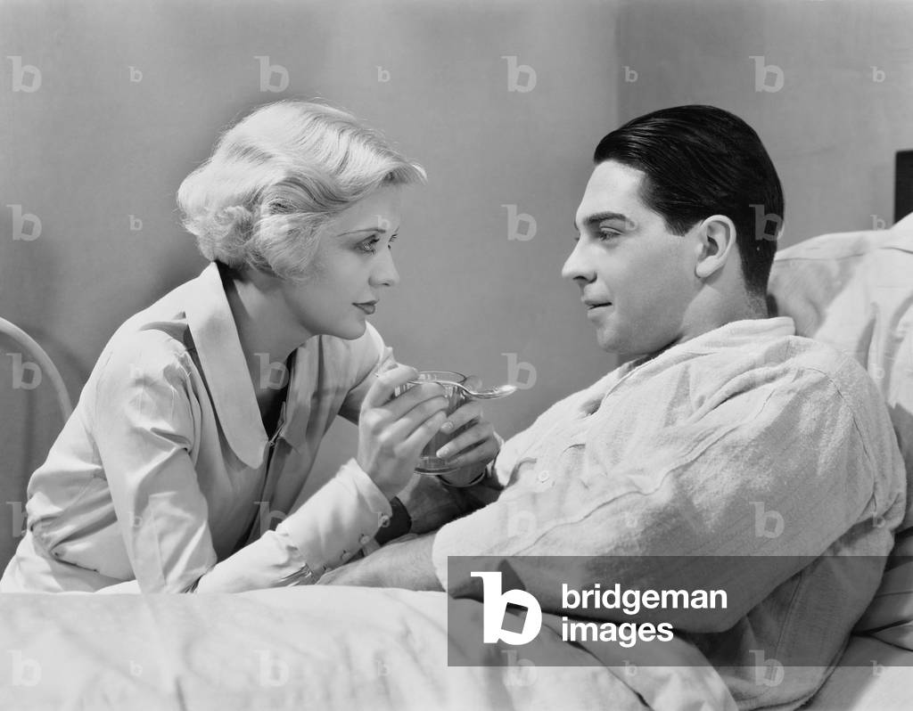Woman Feeding Patient
