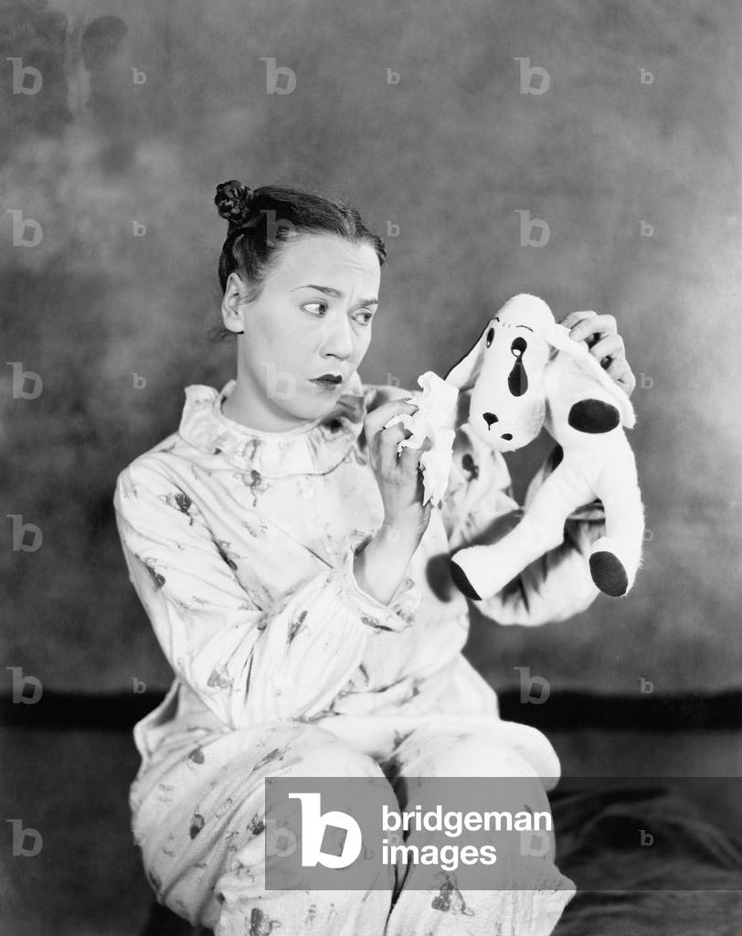 Immature Woman Looking at her Toy Dog