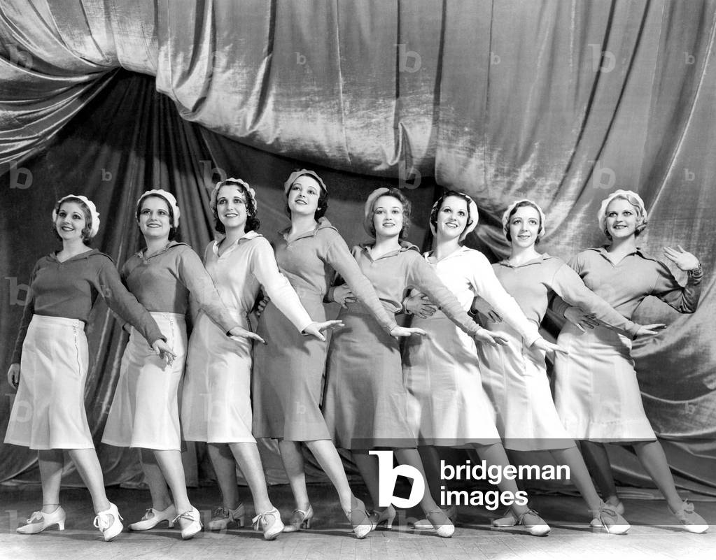 Portrait of Line of Female Dancers on Stage