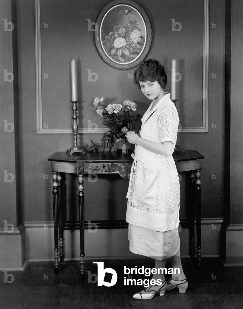 Woman Decorating with Bouquet of Flowers