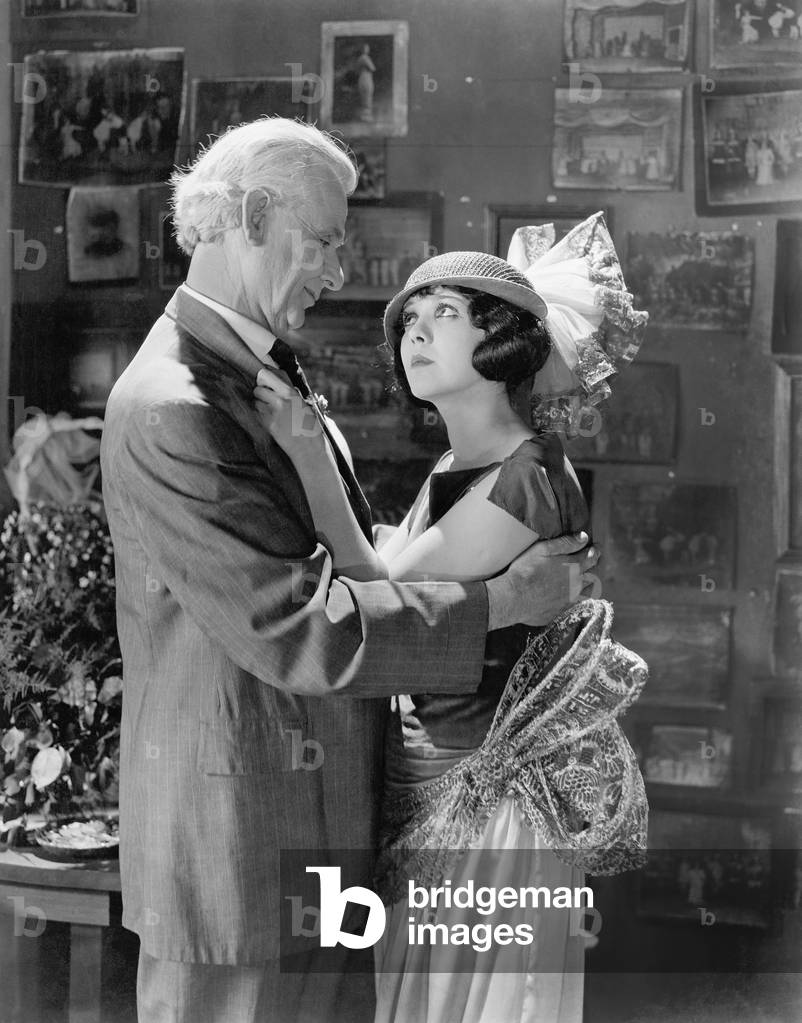 Man and Woman Embracing and Looking at Each Other