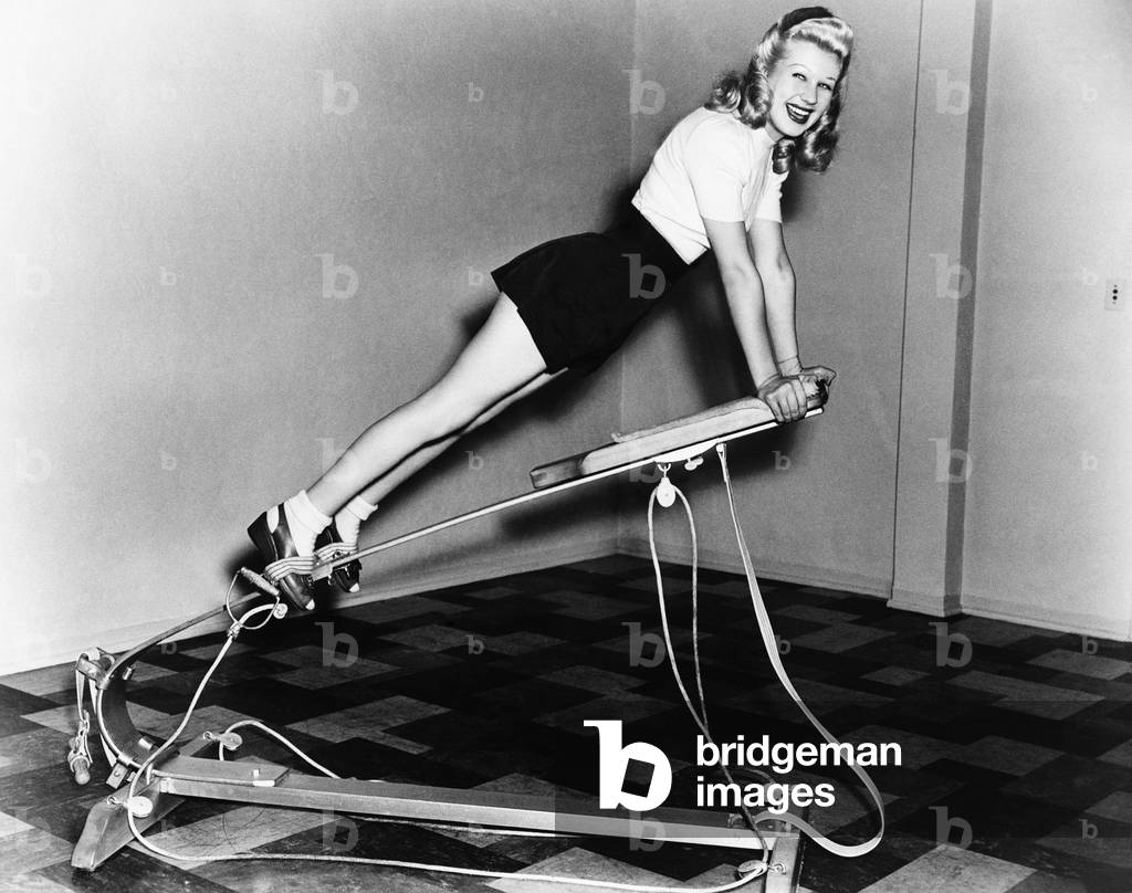 Woman Using Exercise Equipment