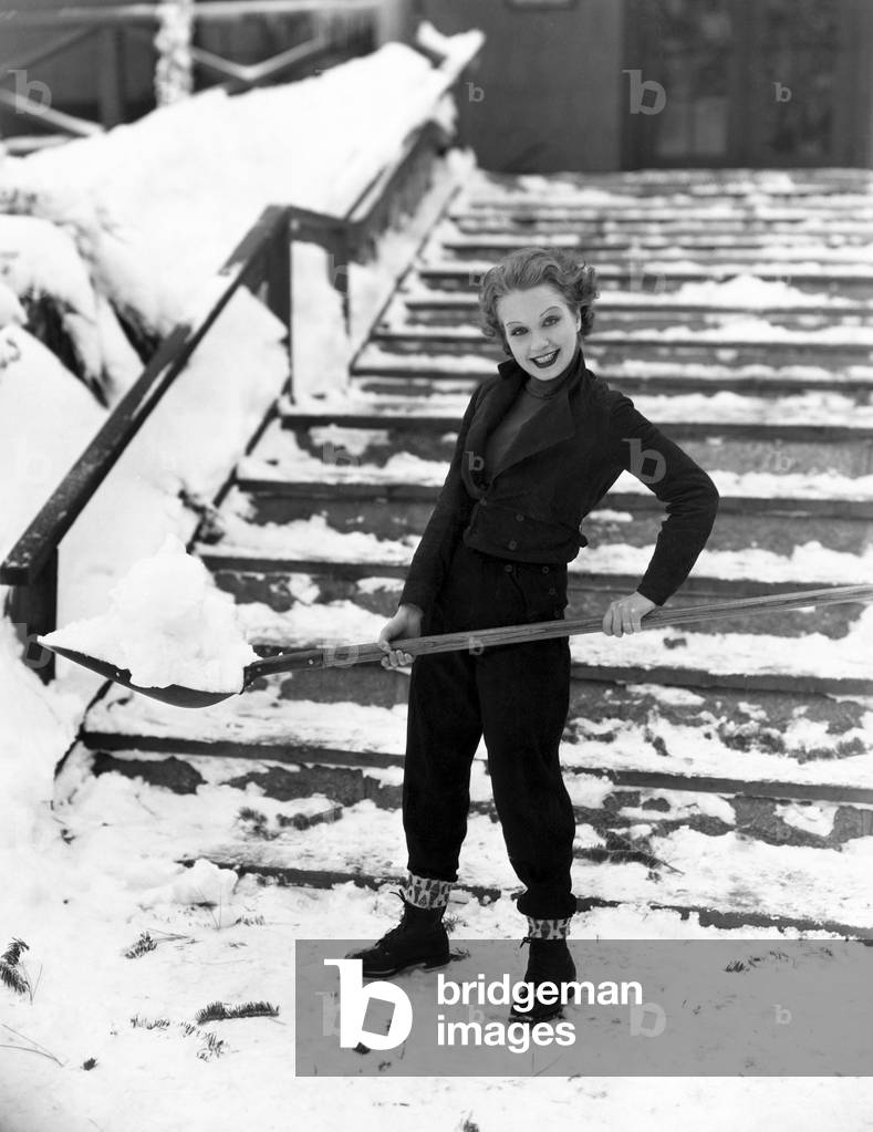Portrait of Woman Shoveling Snow