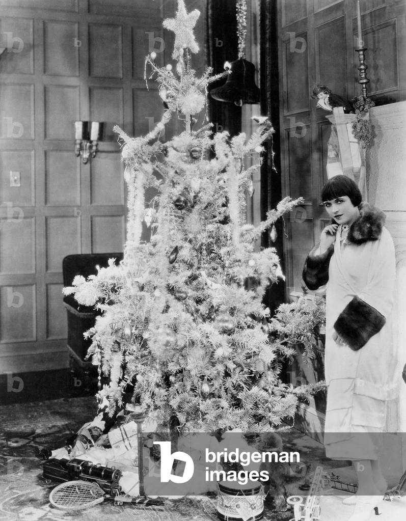Woman with Christmas Tree and Gifts