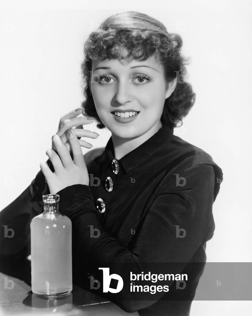 Portrait of a Young Woman with a Bottle Smiling