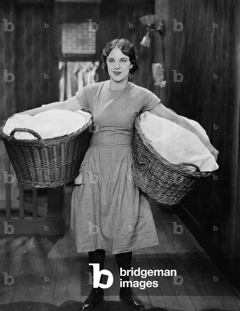 Woman Carrying Laundry Baskets