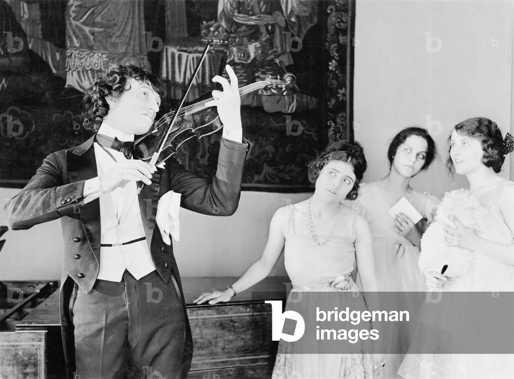 Three Young Women Looking with Adoration at a Violin Player