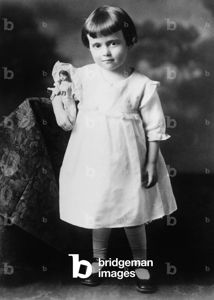 Portrait of Little Girl with Doll