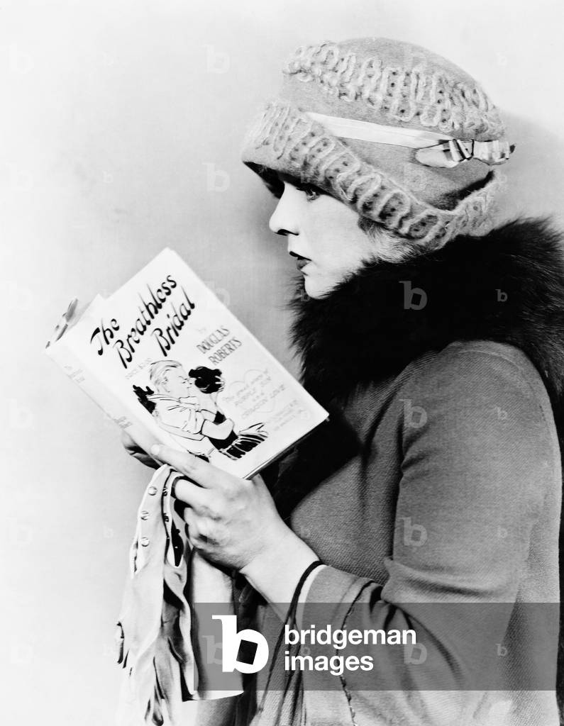 Profile of a Young Woman Reading a Book