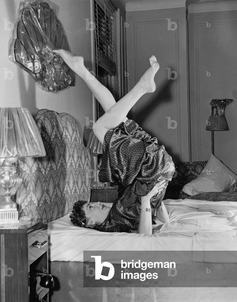 Woman Doing Yoga on Bed