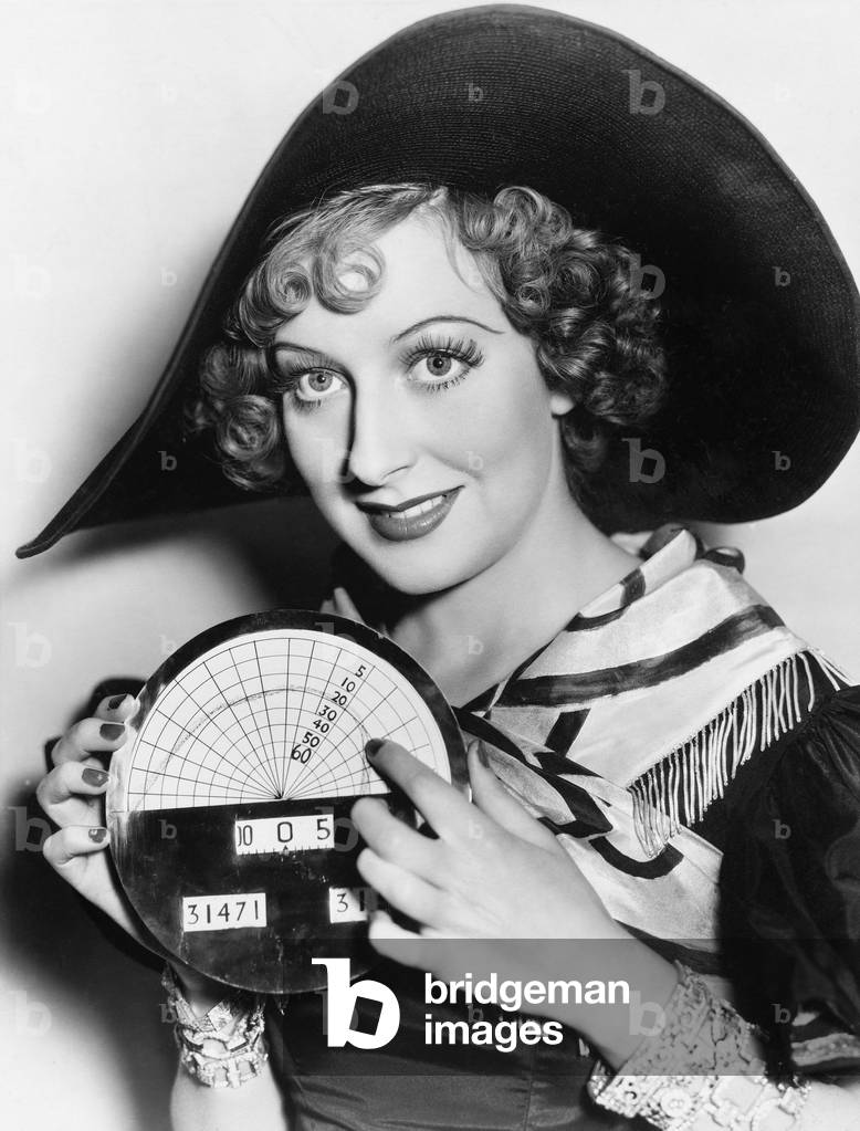 Portrait of a Young Woman in a Hat Holding a Newly Invented Speedometer