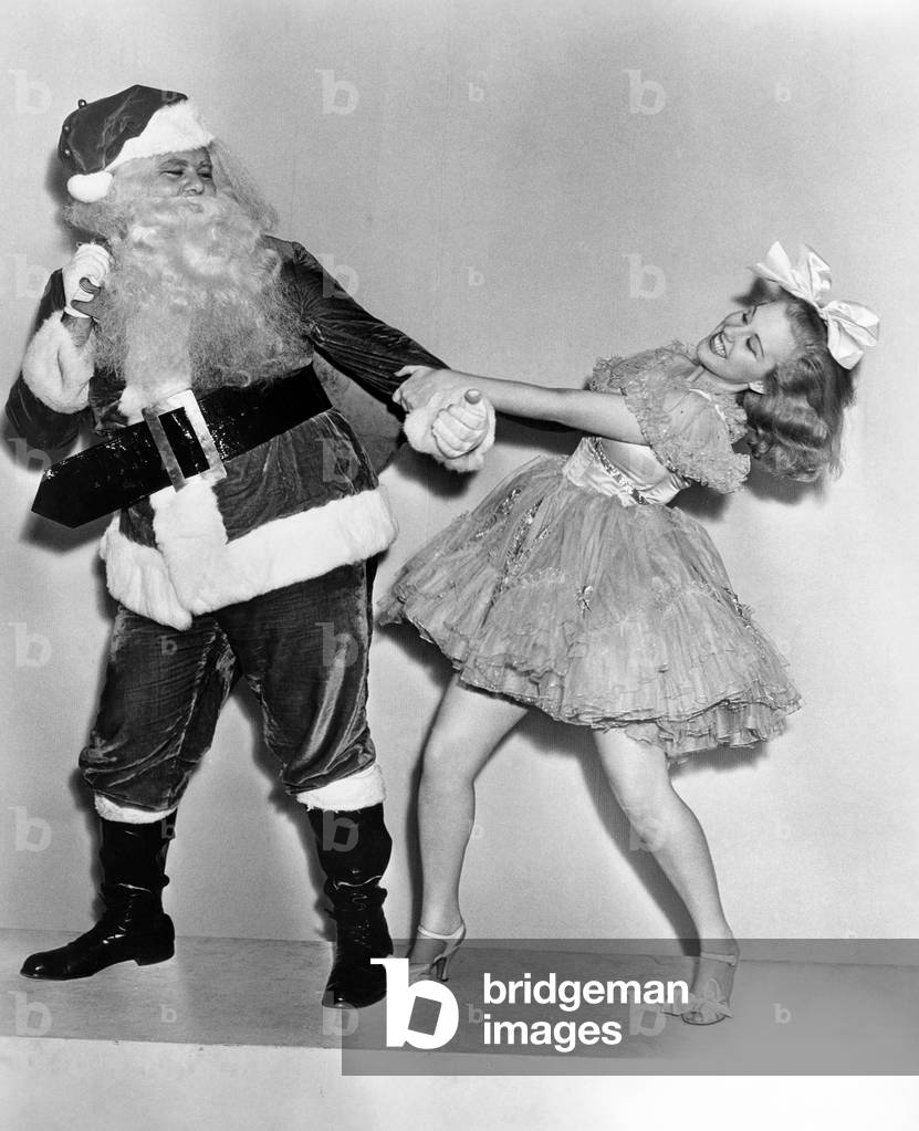 Woman Trying to Dance with Santa Claus