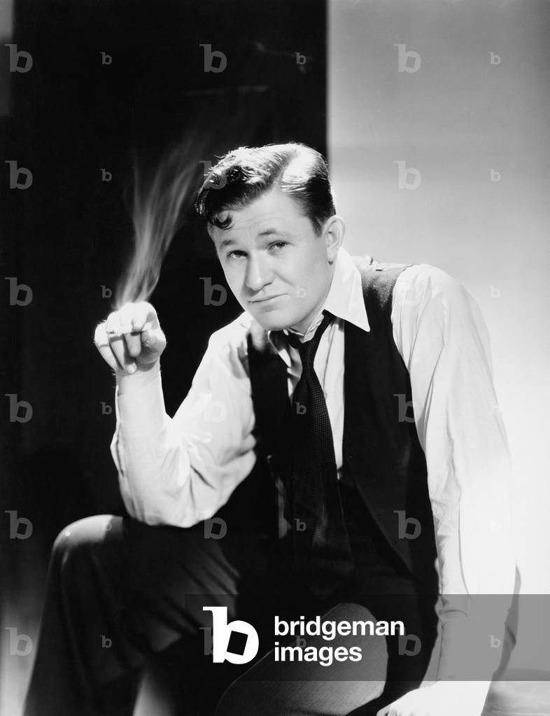 Man Sitting and Smoking a Cigarette