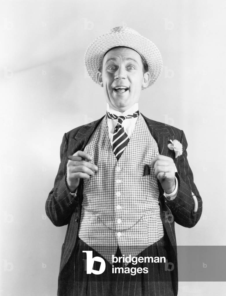 Man in a Vest Looking Happy and Proud