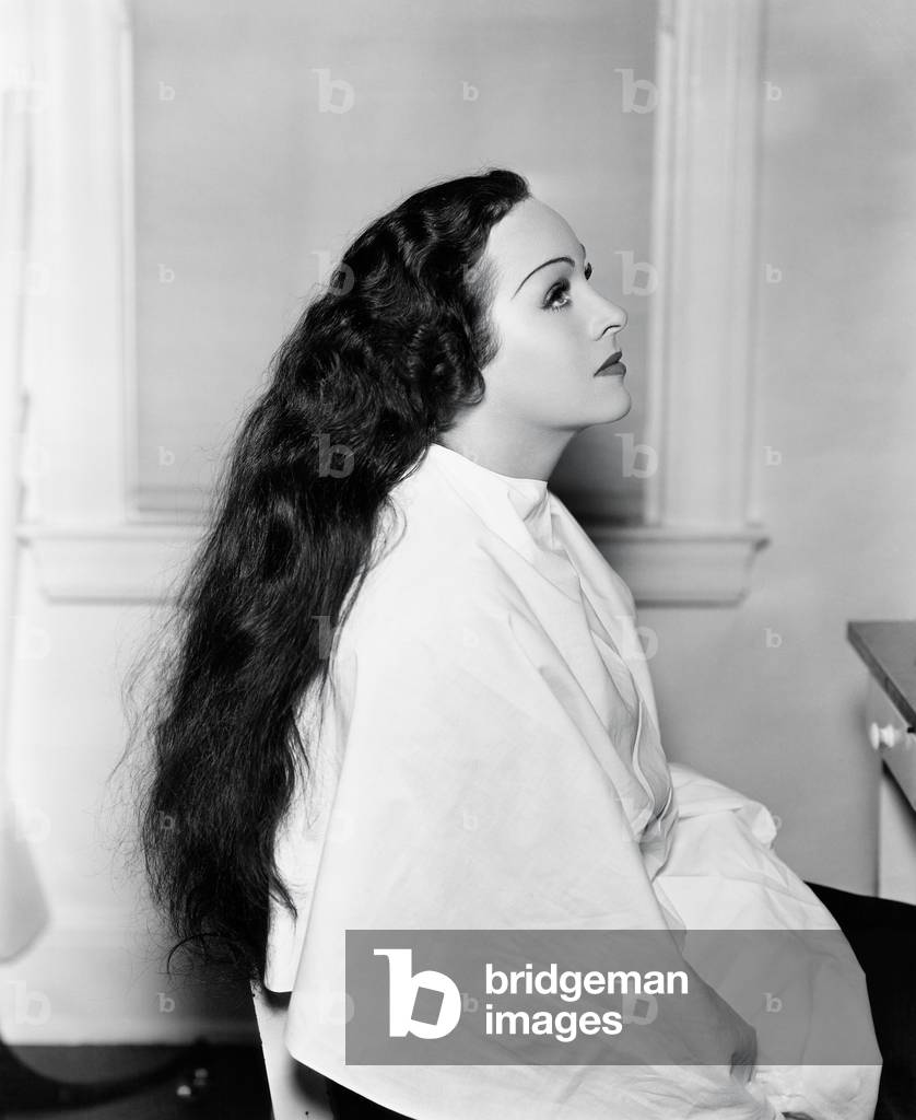 Profile of a Young Woman Sitting in a Hair Salon with Very Long Hair