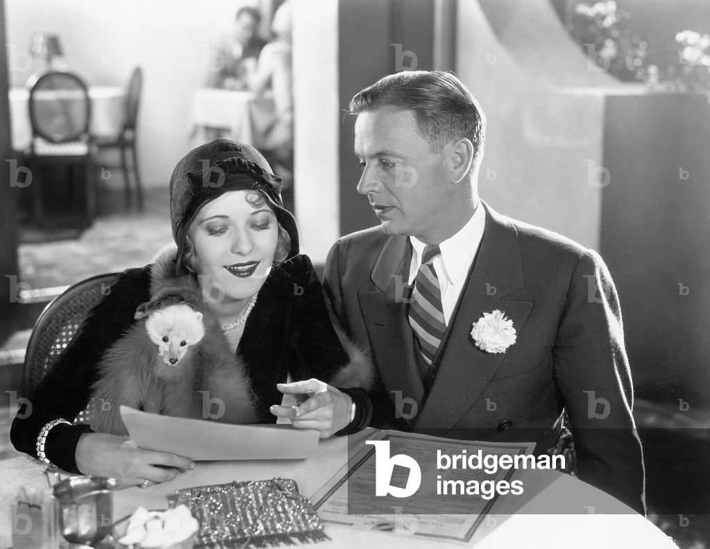 A Couple Sitting Together at a Dinner Table
