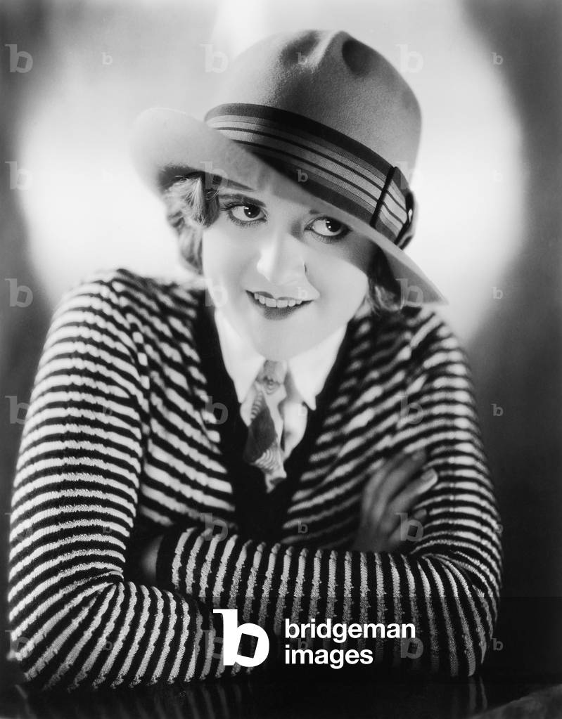 Portrait of a Young Woman in a Hat Smiling