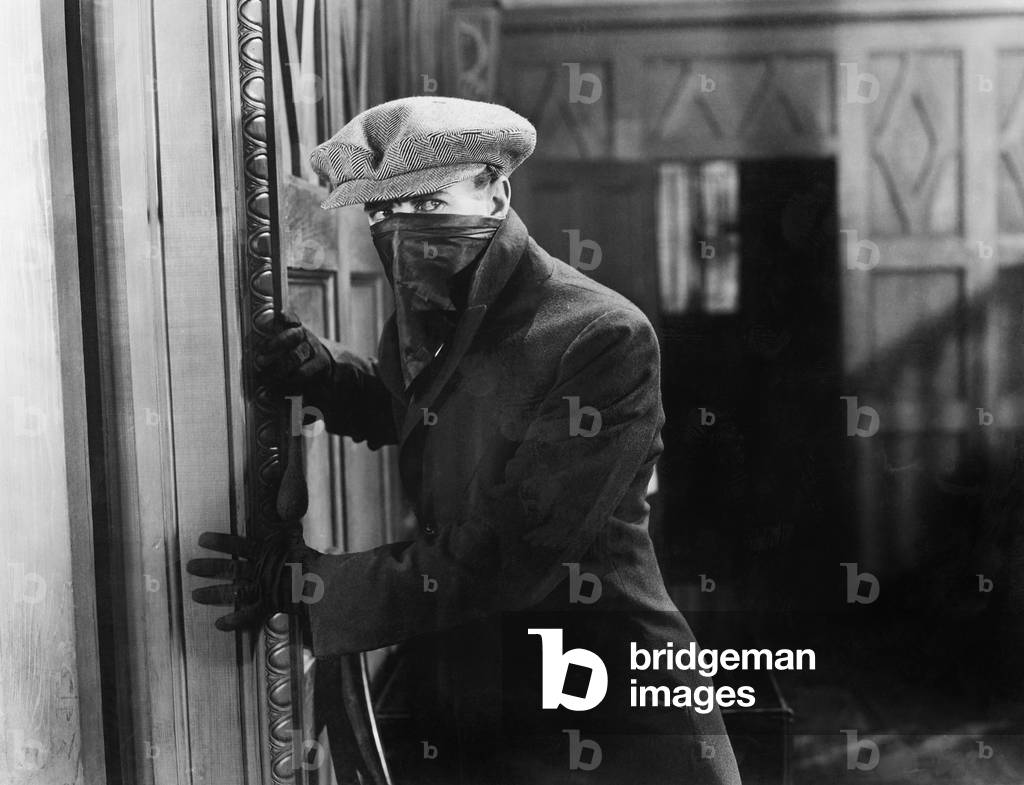 Burglar with Mask in a Home