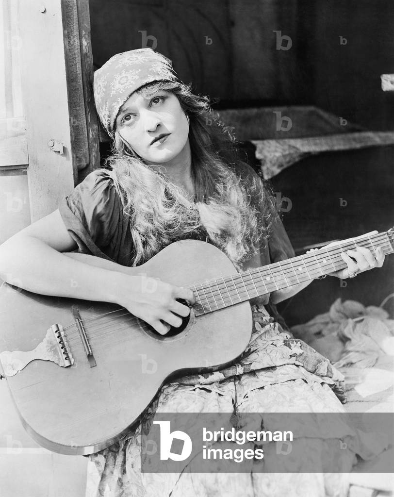 Portrait of Woman Playing Guitar