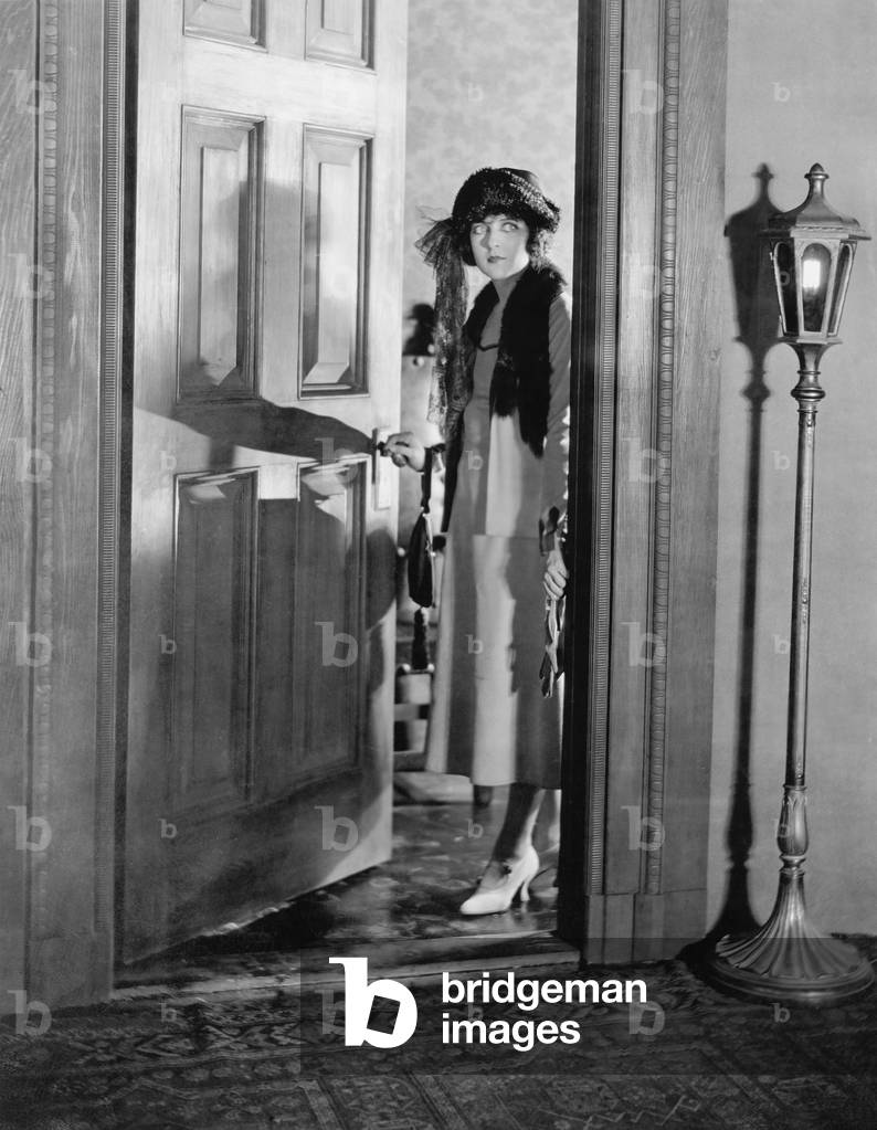 Woman Dressed up Standing in the Doorway