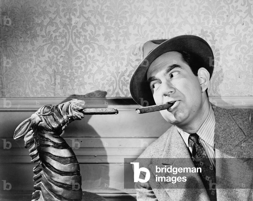 Portrait of a Man Smoking a Cigar with a Sculpture of a Zebra Smoking