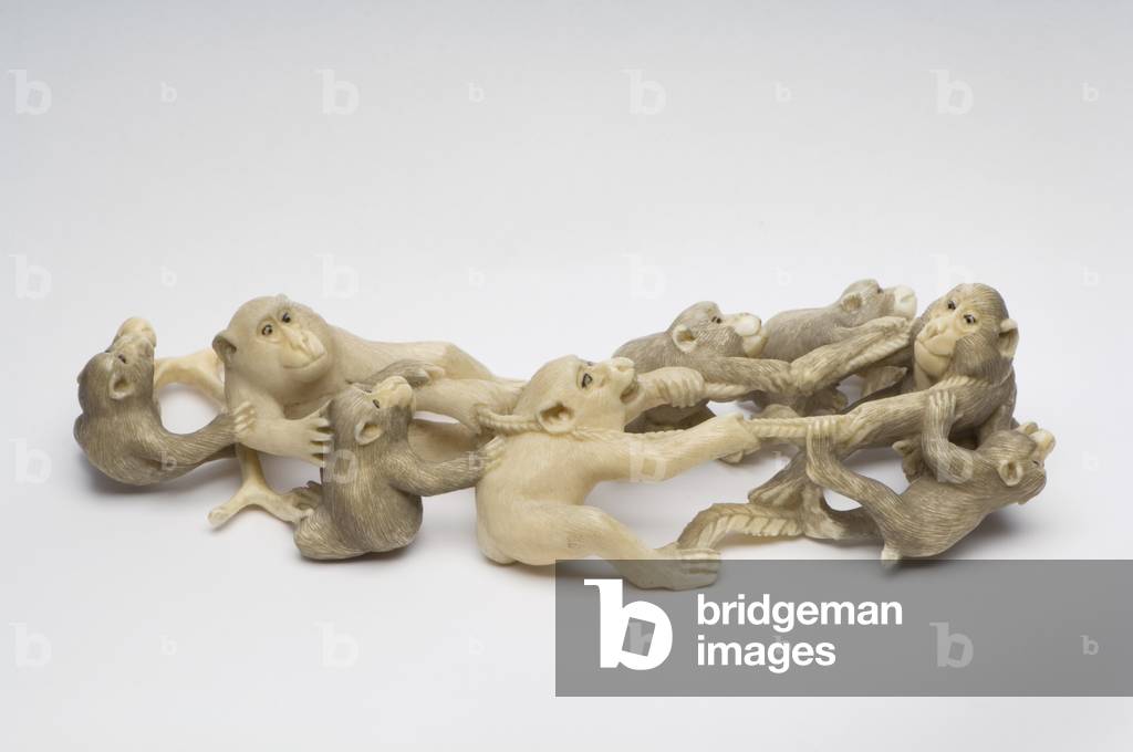 Okimono carved as eight Japanese Macacque monkeys engaged in neck wrestling (ivory)