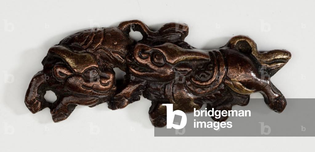 Menuki, or grip ornament, in the form of two Kirin, mythical beasts (copper-gold alloy with gilding)