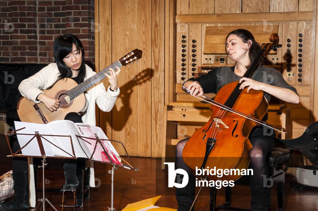 Xuefei Yang (Left) and Natalie Clein (Right) rehearsing together at the Turner Sims Concert Hall