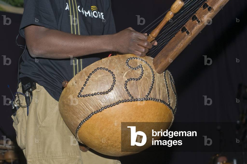 Kora detail showing strings and hand position