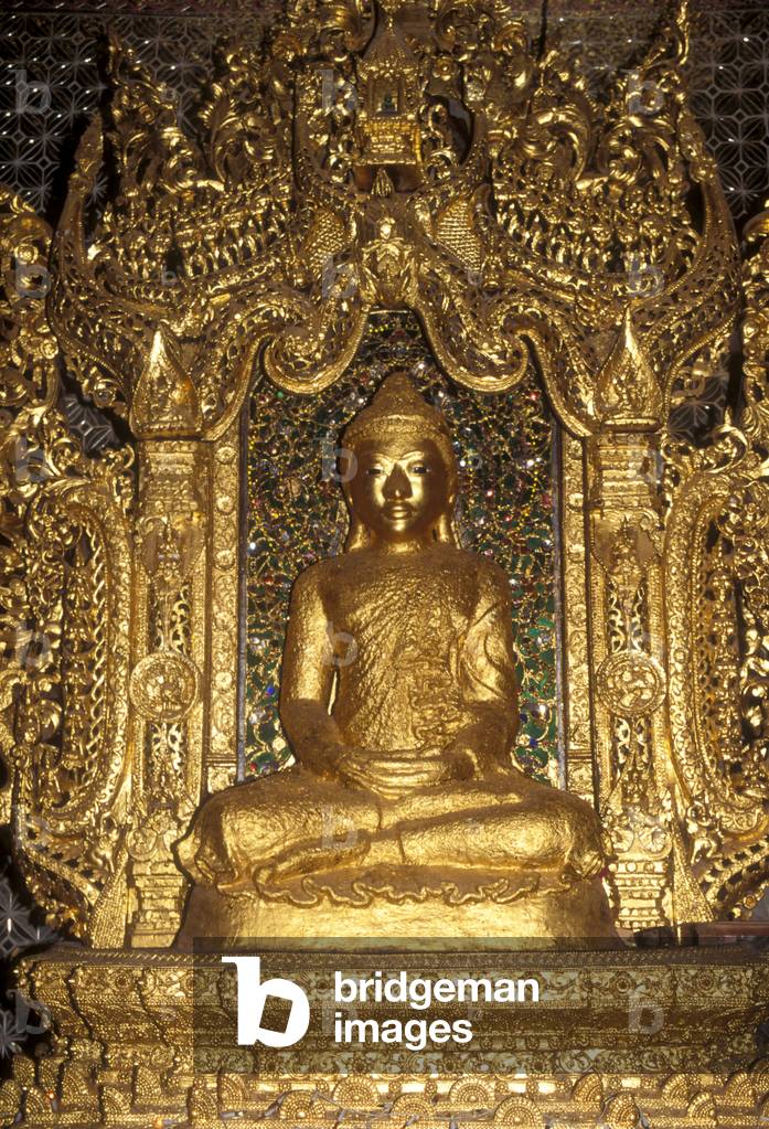 Buddha statue covered in gold leaf (photo)
