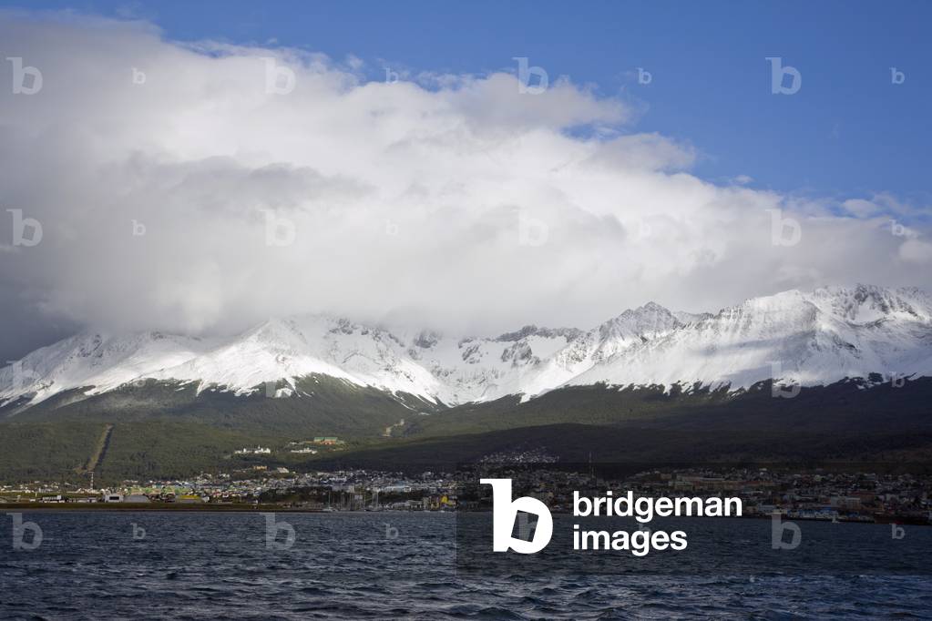 In the Beagle Channel looking back at Ushuaia town with the Martial Range behind (photo)