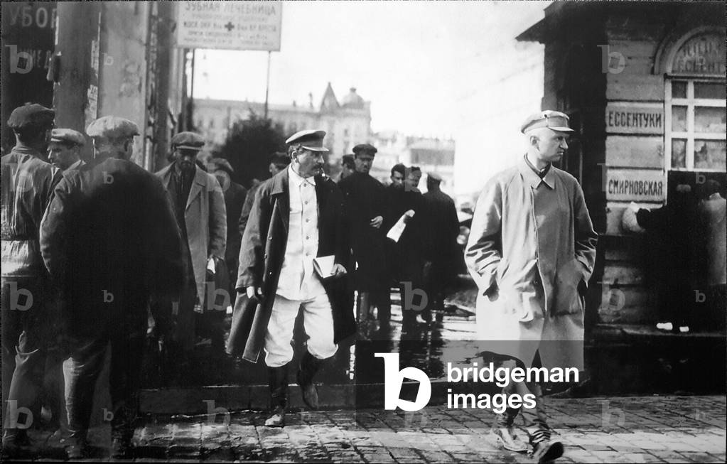 Joseph Stalin escorted by GPU secret agents (b/w photo)