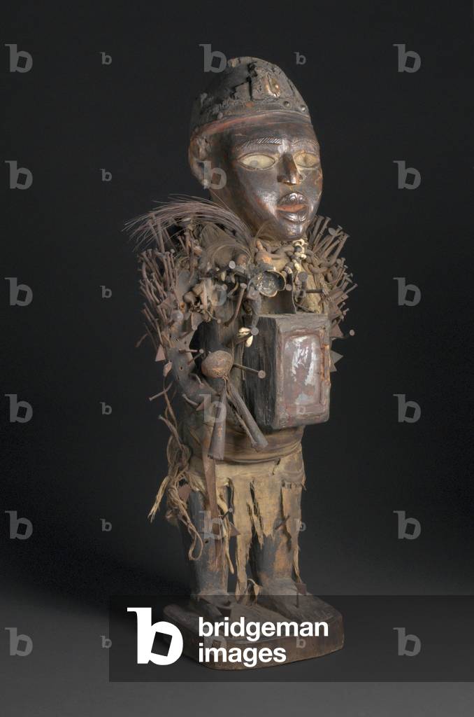Power Figure (Nkisi Nkondi), early-mid-19th century (wood, metal, glass, fabric, fibre, cowrie shell, bone, leather, gourd, & feather)