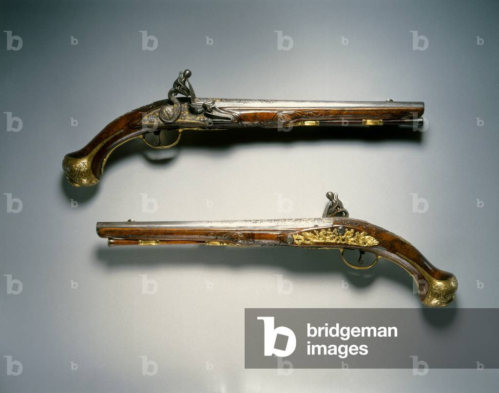 Pair of flintlock pistols, Liège, early 18th century (steel, gold inlay, gilt-brass & walnut)