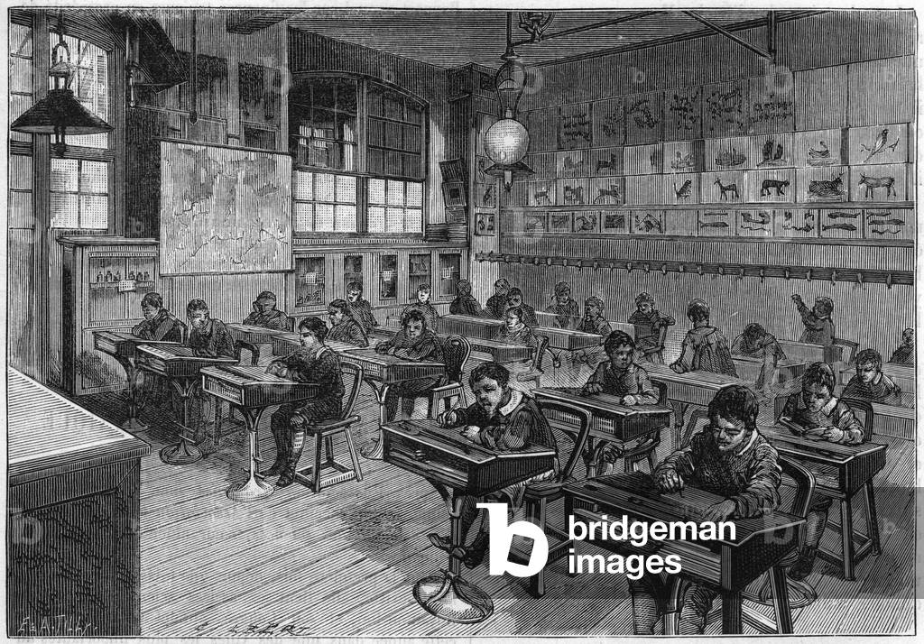 View of an elemental class of L'Ecole Monge (primary school, elementary school). Each table mounted on an iron leg is equipped with a transparent ice that allows you to see the inside of the desk. in “” La Nature. Review of sciences and their applications to the arts and industry.””