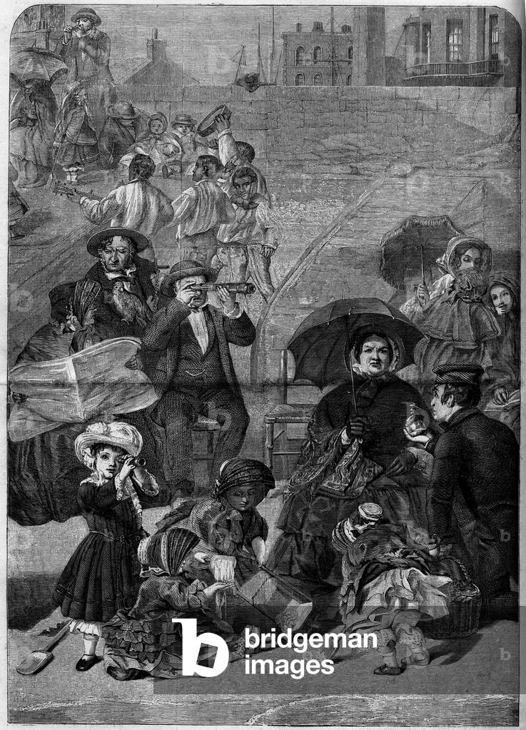 Victorian England: Tourists on the Beach of Ramsgate, England, 1859. From a painting by Frith. Engraving in “” Le Monde Illustré”” n°100 of 13 March 1859.