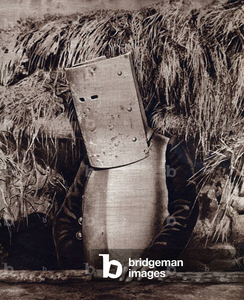 First World War (1914-1918): A watchman mask and armour watching a German trench close in 1914.
