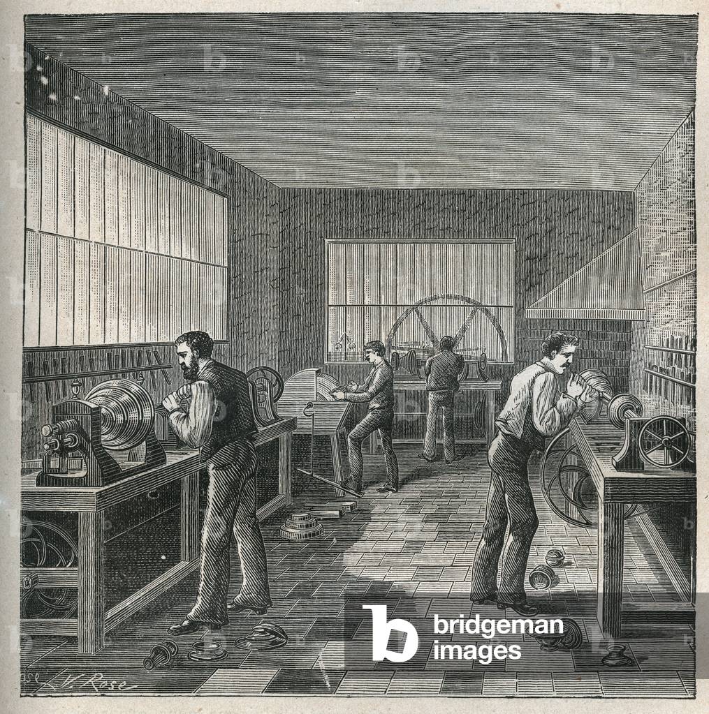 The art of lathe: metal work in a workshop of a turnner-repeller. Engraving from 1885 in “” Les arts et metiers illustres”” by Adolphe BITARD.