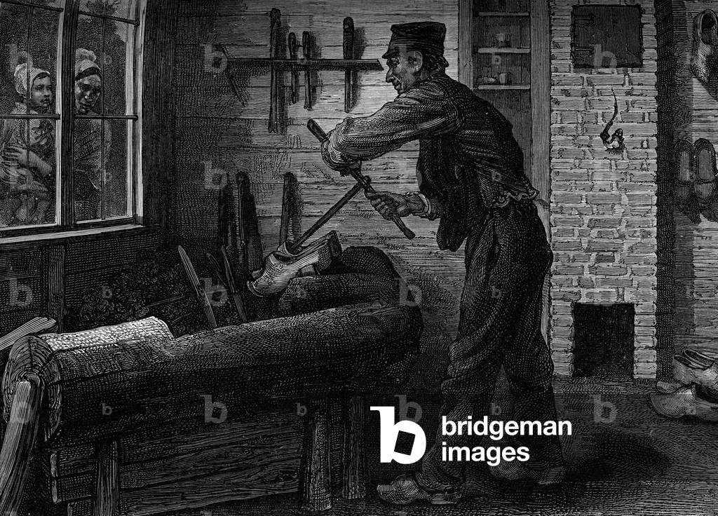 A sabotier at work in his workshop in Belgium, Engraving in the journal “” la jeunesse””, 1888.