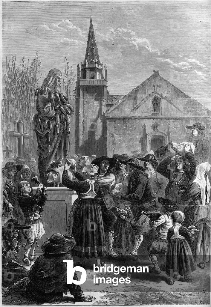 Breton custom: “festar goadgennon” or “the fete des boudins”. The inhabitants of a village cover with socks a statue of Saint Anthony the Great (or Saint Anthony the Hermit or Saint Anthony the Abbe). Some farmers bring a pig's head. Engraving in “” Le Monde Illustré”” n°825 of 1st February 1873.