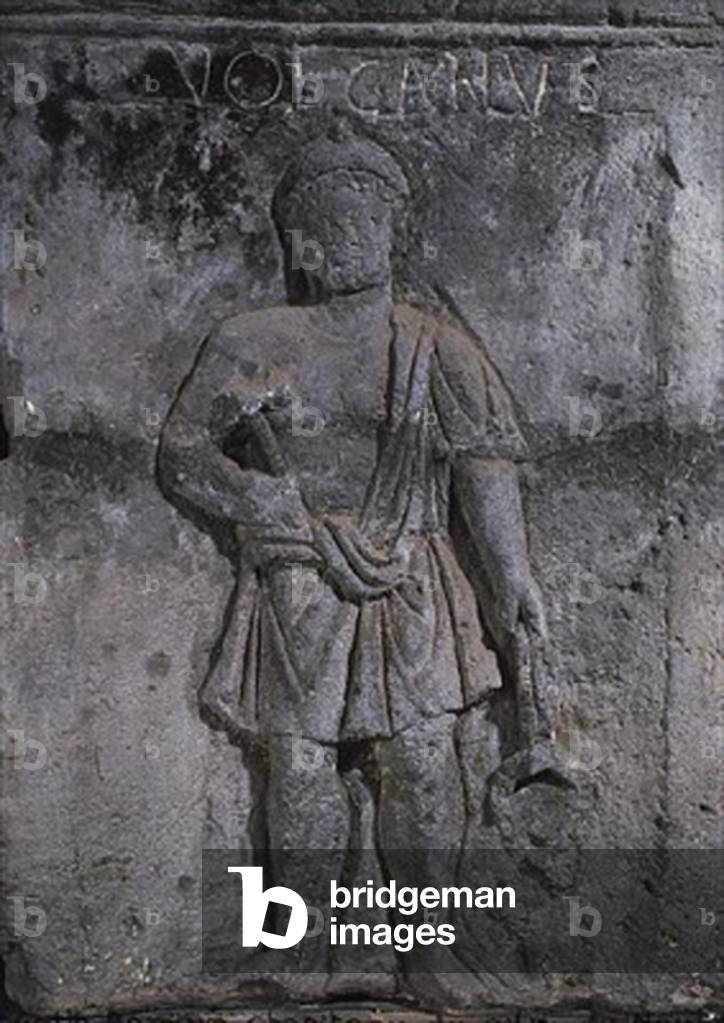 Capital of the Nautes Pillar depicting Vulcan holding a hammer (stone)