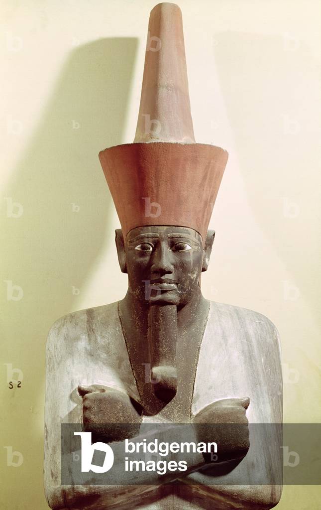 Detail of a statue of Mentuhotep II, enthroned and wearing the red crown of Lower Egypt, taken from the Mortuary Temple of Mentuhotep II, at Deir el-Bahri, Middle Kingdom (painted sandstone)