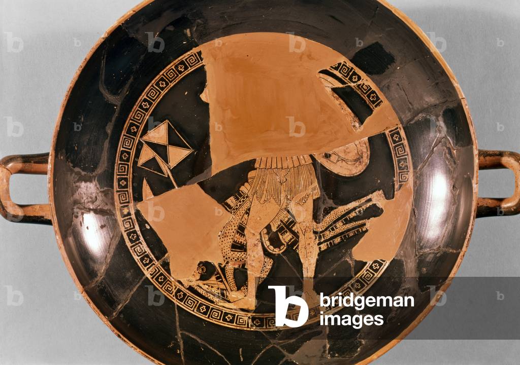 Attic red-figure cup depicting a Greek hoplite beating a fallen Persian soldier who is holding a standard, c.490 BC (pottery)