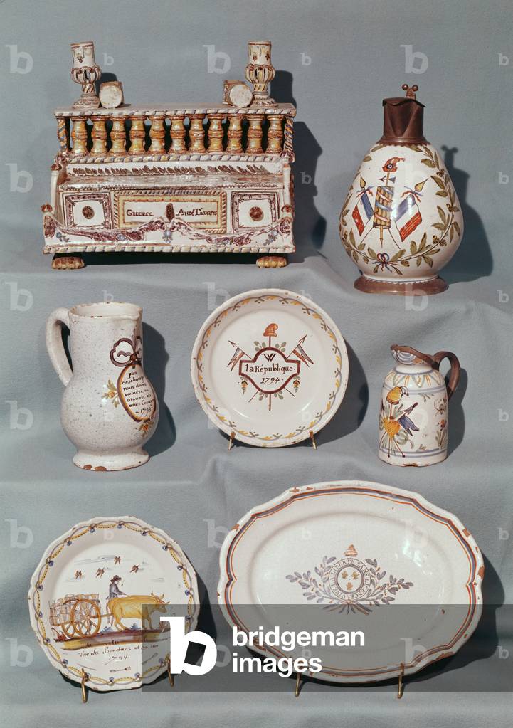 Plates, dish, jug, tobacco jar; writing case and tankard inscribed with French Revolutionary motifs and slogans, end 18th century (faience)