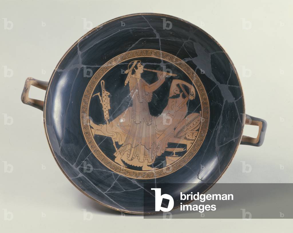 Attic red-figure cup depicting a woman playing a double flute (pottery)