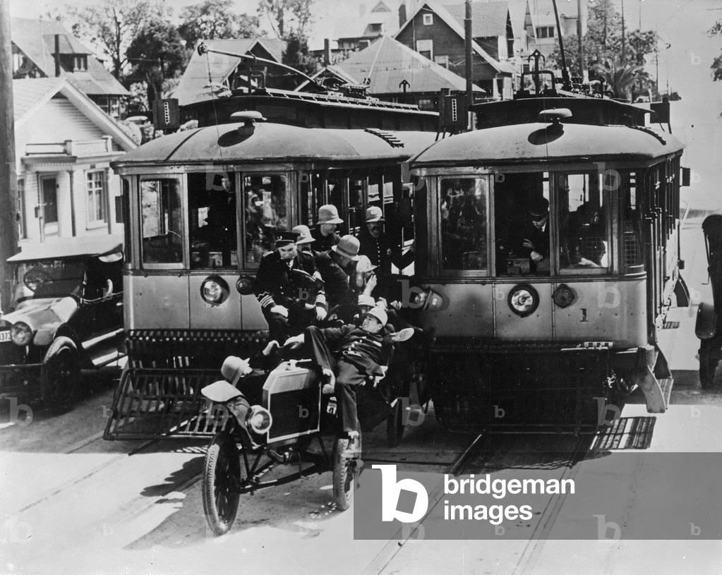 The Keystone Kops being chased by two trams (photo)