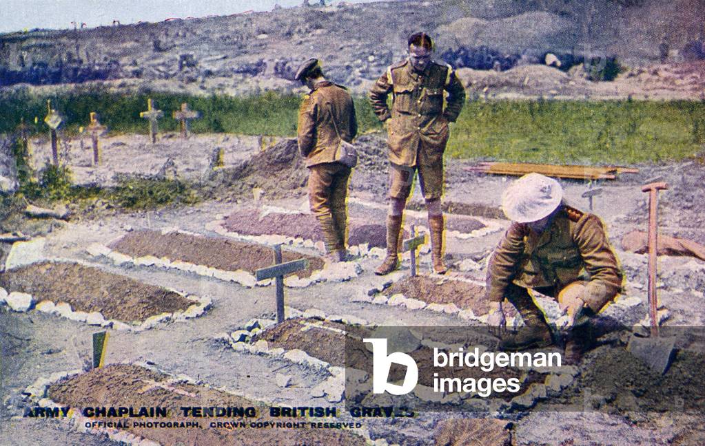 World War 1: British army chaplain tending to graves