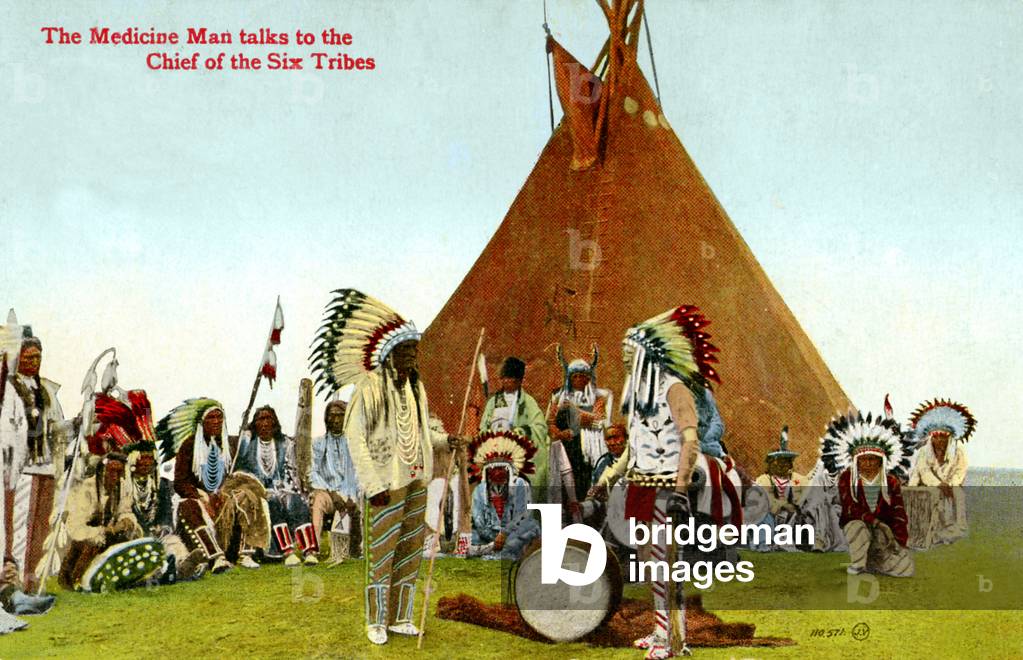 The Medicine Man talks to the Chief